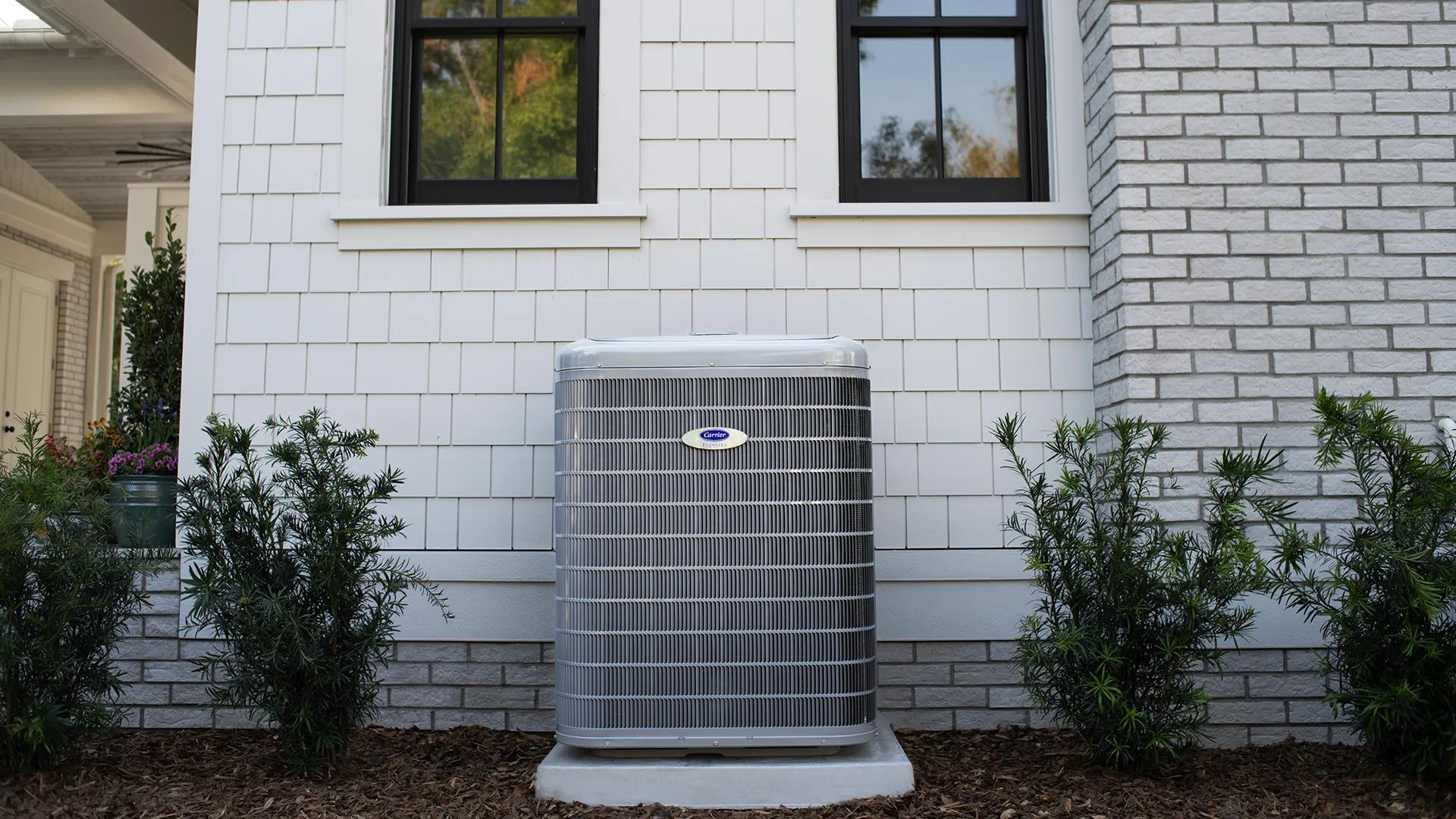 Carrier Infinity air conditioner installed outside a home